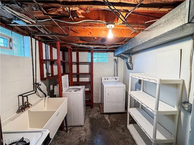 clothes washing area featuring washer and dryer and a healthy amount of sunlight