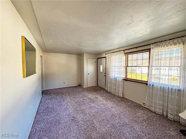 spare room featuring carpet flooring