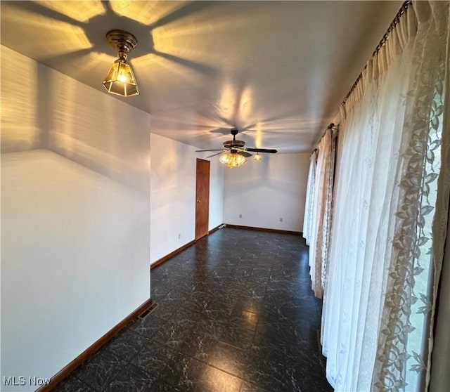 unfurnished room with ceiling fan