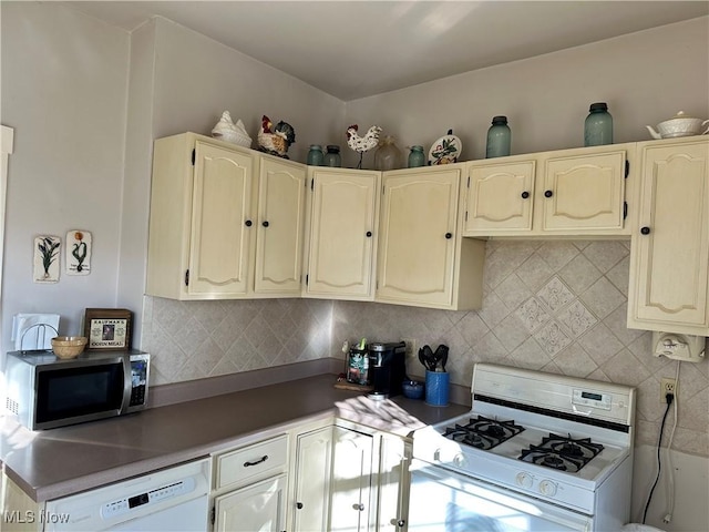 kitchen featuring tasteful backsplash and white appliances