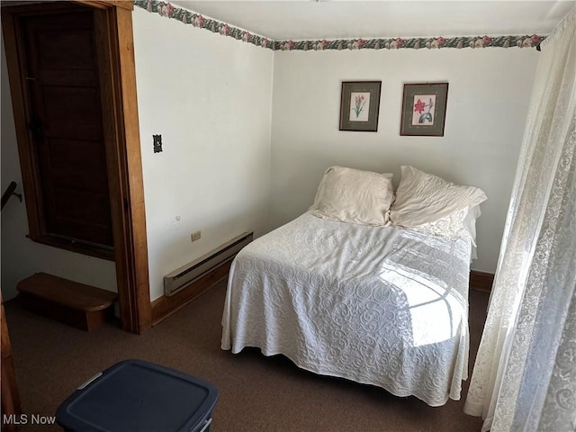 carpeted bedroom featuring a baseboard radiator