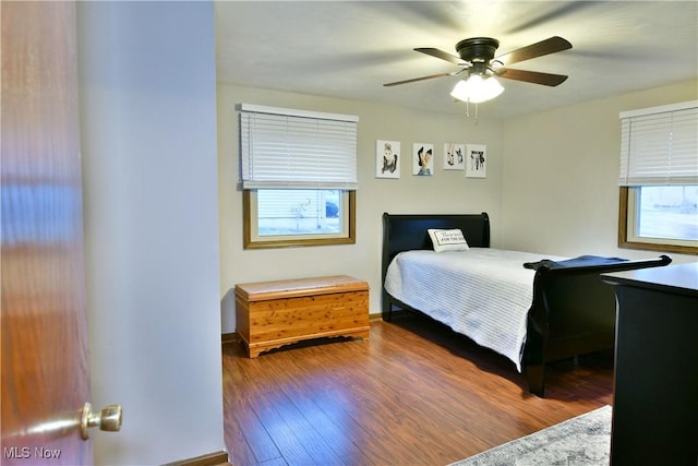 bedroom featuring hardwood / wood-style floors and ceiling fan