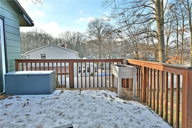 view of snow covered deck