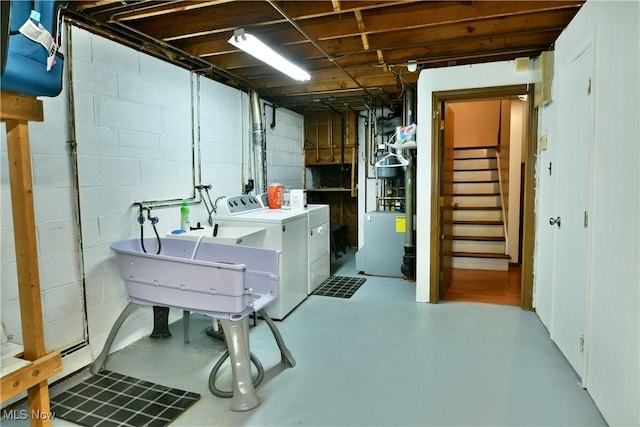 basement with independent washer and dryer and sink