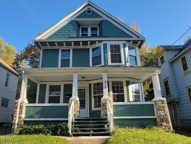 victorian house featuring covered porch