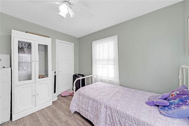 bedroom featuring ceiling fan and light hardwood / wood-style floors