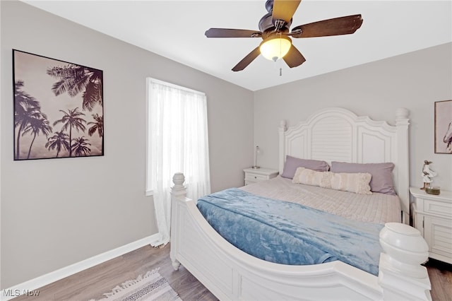 bedroom featuring hardwood / wood-style floors and ceiling fan