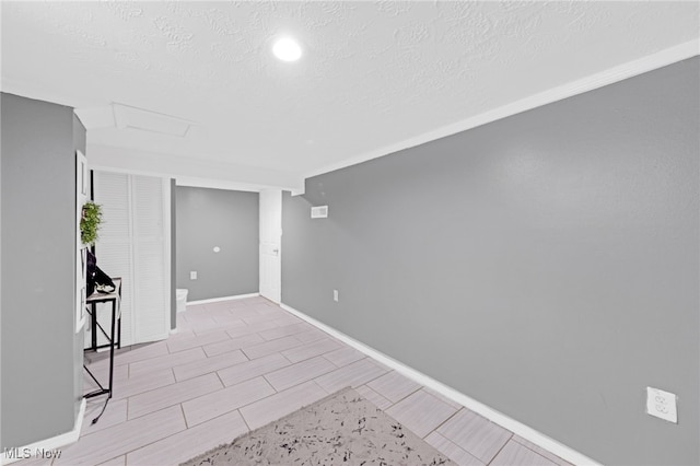 basement featuring a textured ceiling