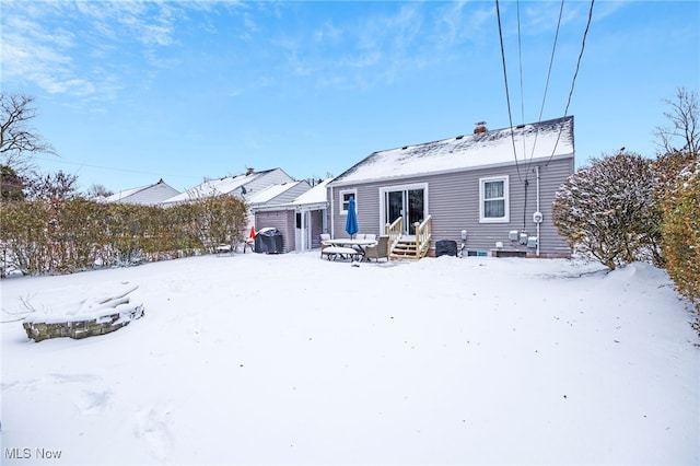 view of snow covered house