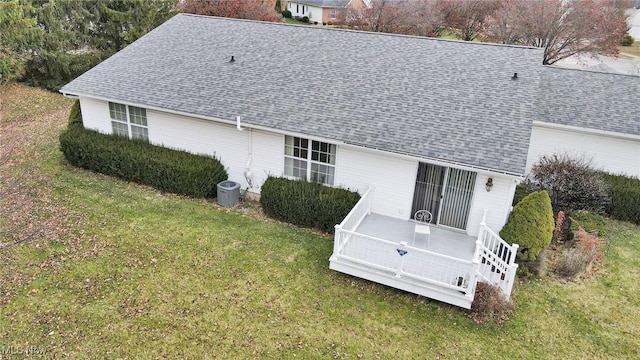 rear view of house with a yard