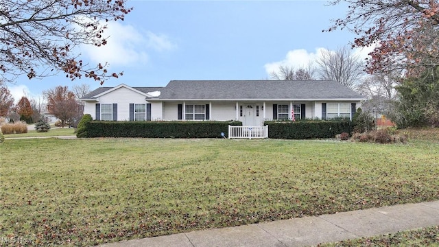 ranch-style house featuring a front lawn