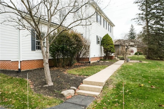 view of home's exterior featuring a yard