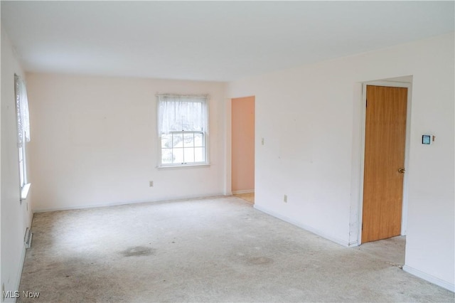 empty room featuring light colored carpet