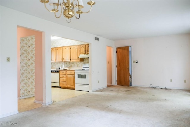 kitchen featuring tasteful backsplash, light brown cabinets, a chandelier, and white appliances