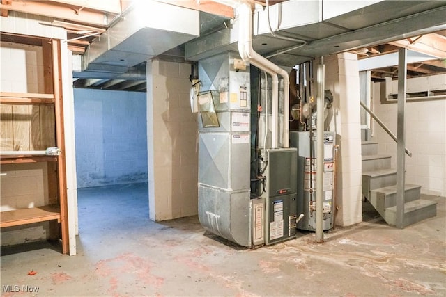 utility room with heating unit and water heater