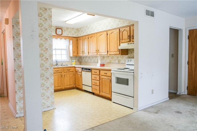 kitchen featuring white appliances and sink