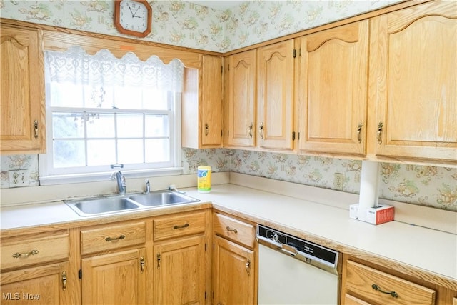 kitchen featuring sink, white dishwasher, and light brown cabinets