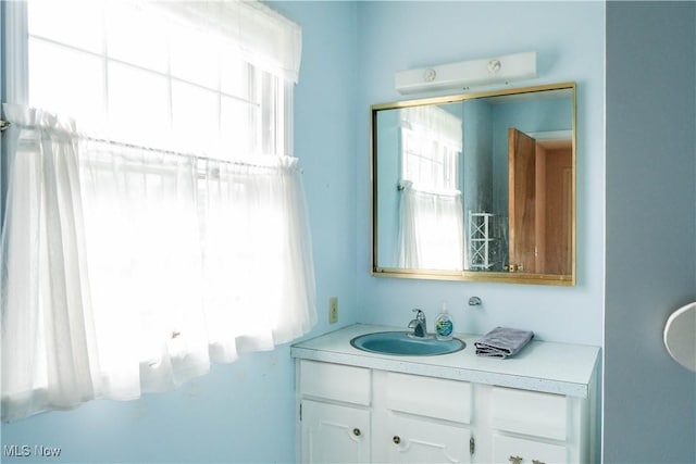 bathroom featuring vanity and a healthy amount of sunlight