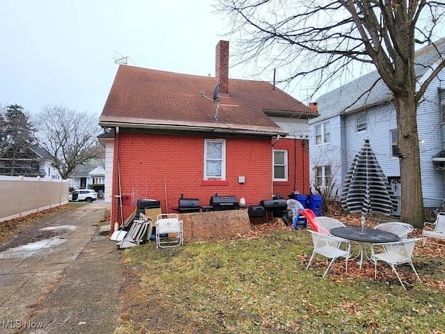 rear view of house with a lawn