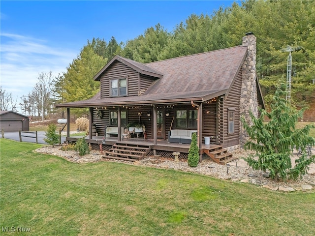 rear view of property featuring a yard