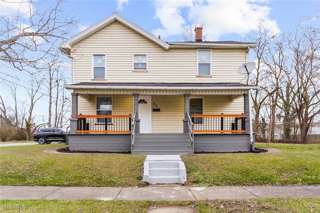 view of front of home featuring a porch and a front lawn