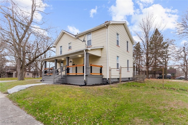 view of front of home featuring a porch and a front yard