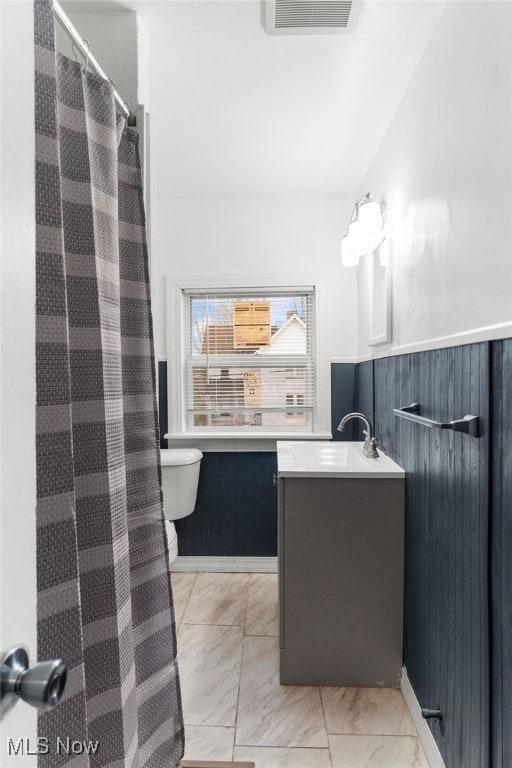 bathroom with vanity and toilet