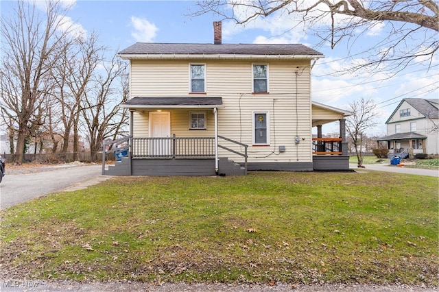 view of front property with a porch and a front lawn