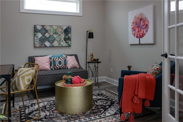 living room with hardwood / wood-style flooring and french doors