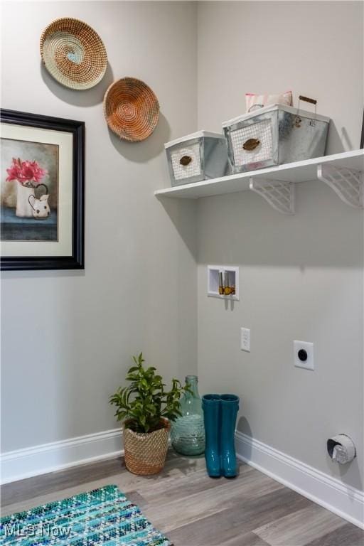 laundry room featuring washer hookup, electric dryer hookup, and wood-type flooring