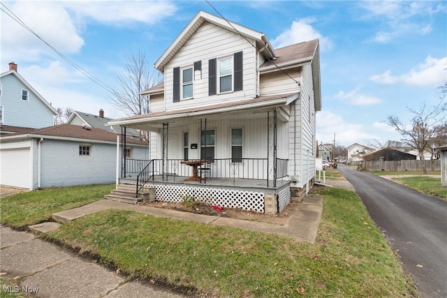 view of front of property with covered porch and a front yard