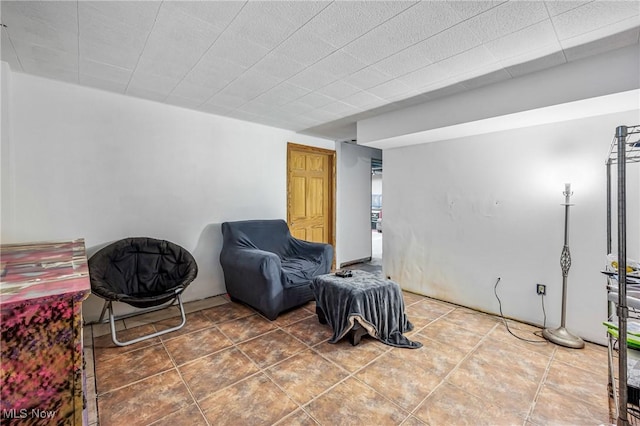 sitting room with tile patterned floors