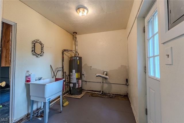 utilities with gas water heater and sink