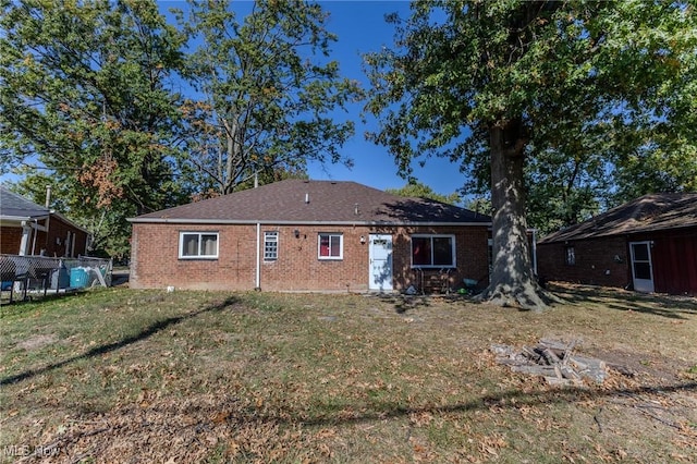 rear view of house with a lawn