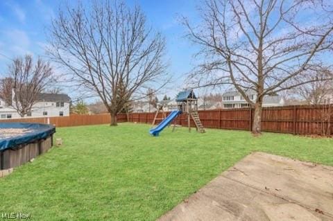 view of yard with a covered pool