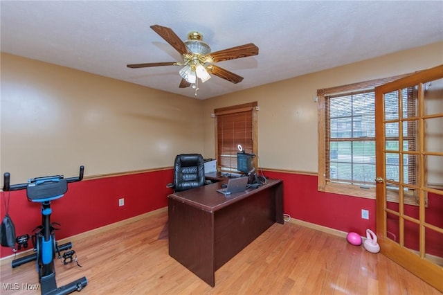 office space featuring hardwood / wood-style flooring and ceiling fan