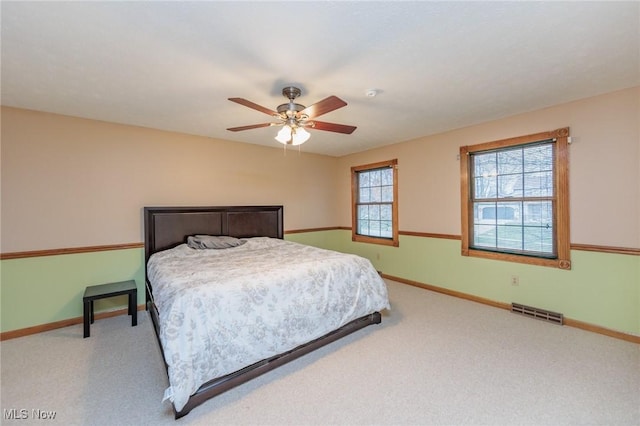 bedroom with ceiling fan and carpet floors