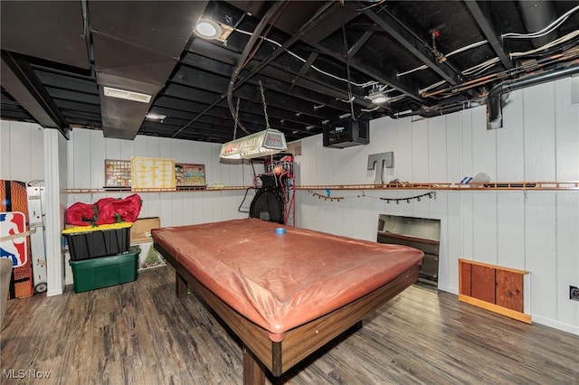 playroom with dark hardwood / wood-style floors, wood walls, and pool table