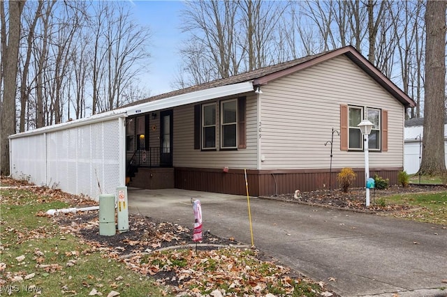 view of front of home featuring a carport