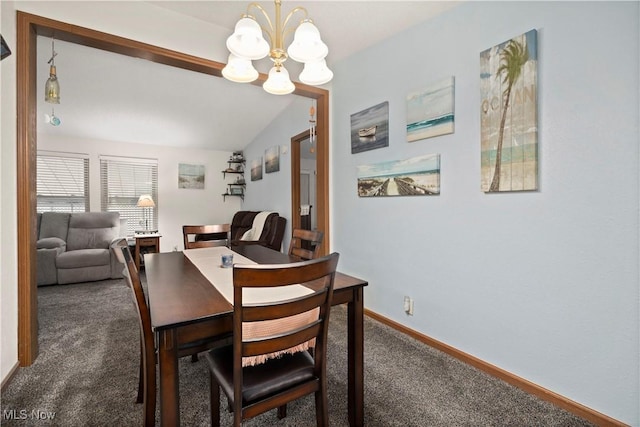 carpeted dining area featuring a chandelier and lofted ceiling