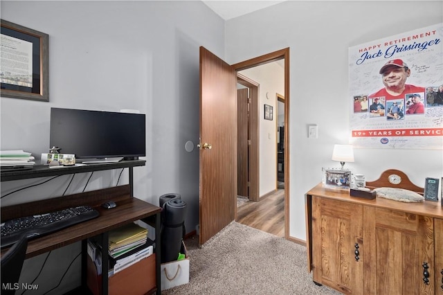 office space with light hardwood / wood-style flooring