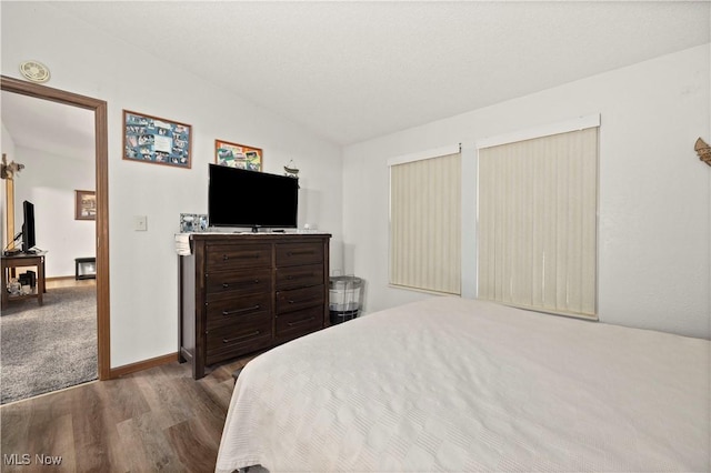 bedroom with wood-type flooring