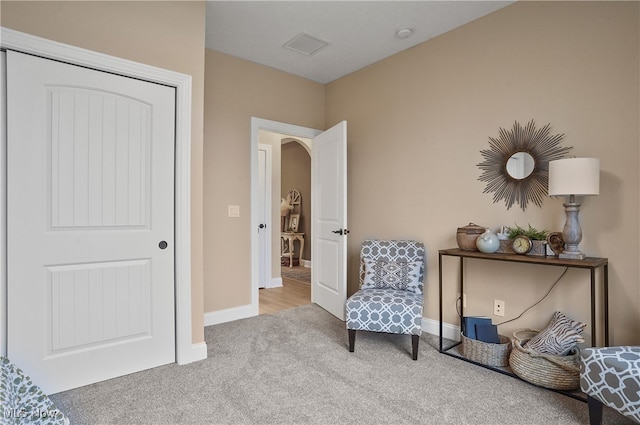 sitting room with light carpet