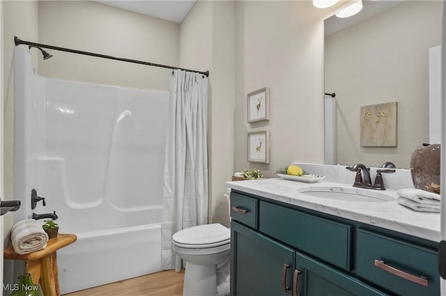 full bathroom with shower / bath combination with curtain, toilet, wood-type flooring, and vanity