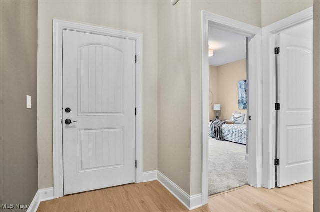 corridor featuring light hardwood / wood-style flooring