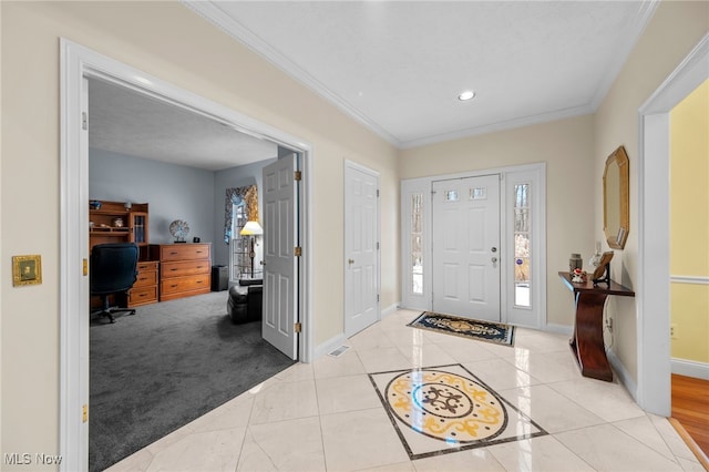 entrance foyer featuring light carpet and ornamental molding