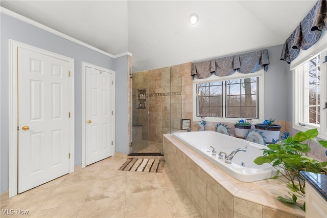 bathroom with plus walk in shower, tile patterned flooring, and ornamental molding