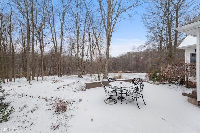 view of yard layered in snow