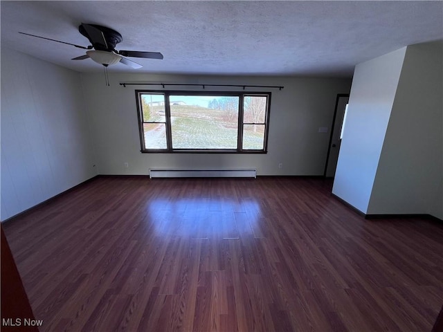 unfurnished room with ceiling fan, a baseboard heating unit, dark wood-type flooring, and a textured ceiling