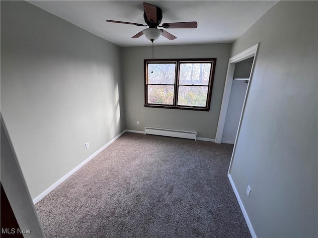 unfurnished bedroom with baseboard heating, ceiling fan, carpet flooring, and a closet